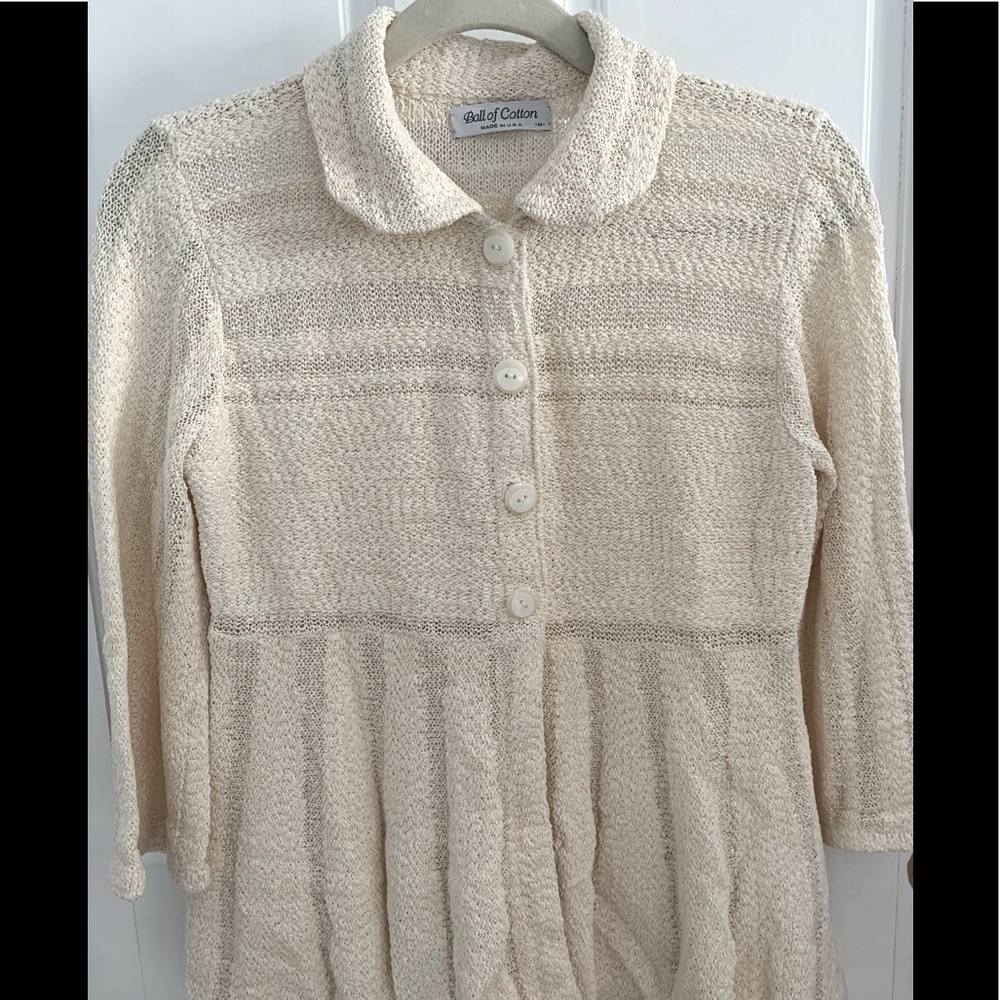Ball of cotton hand loomed ivory sweater